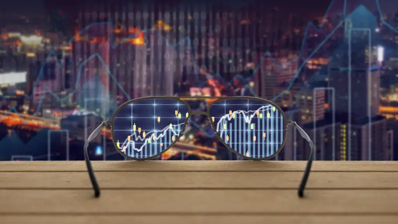 Durch eine Brille gesehen werden verschwommene Chartverläufe klarer